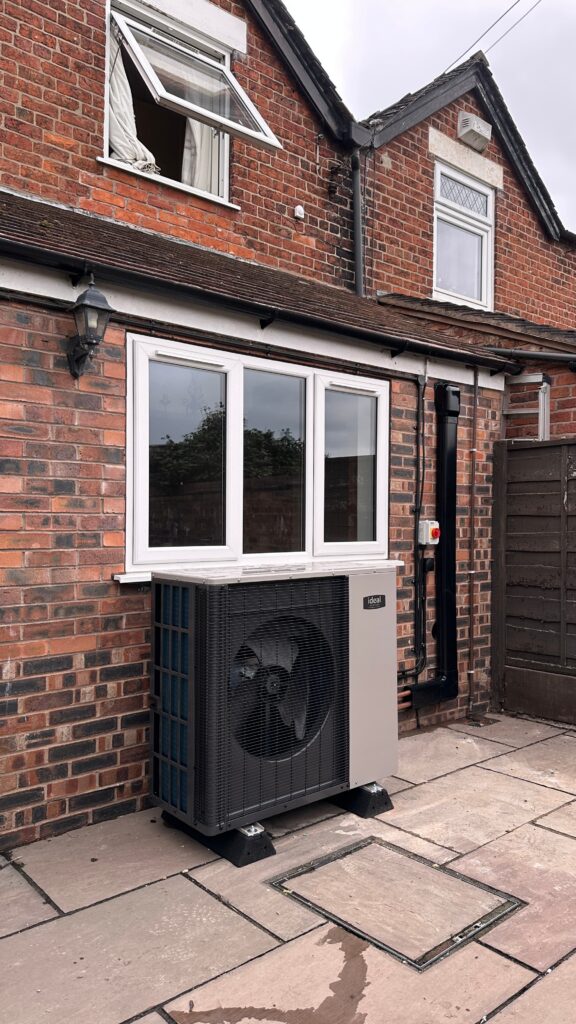Ideal Logic Air heat pump installed outside a rural home