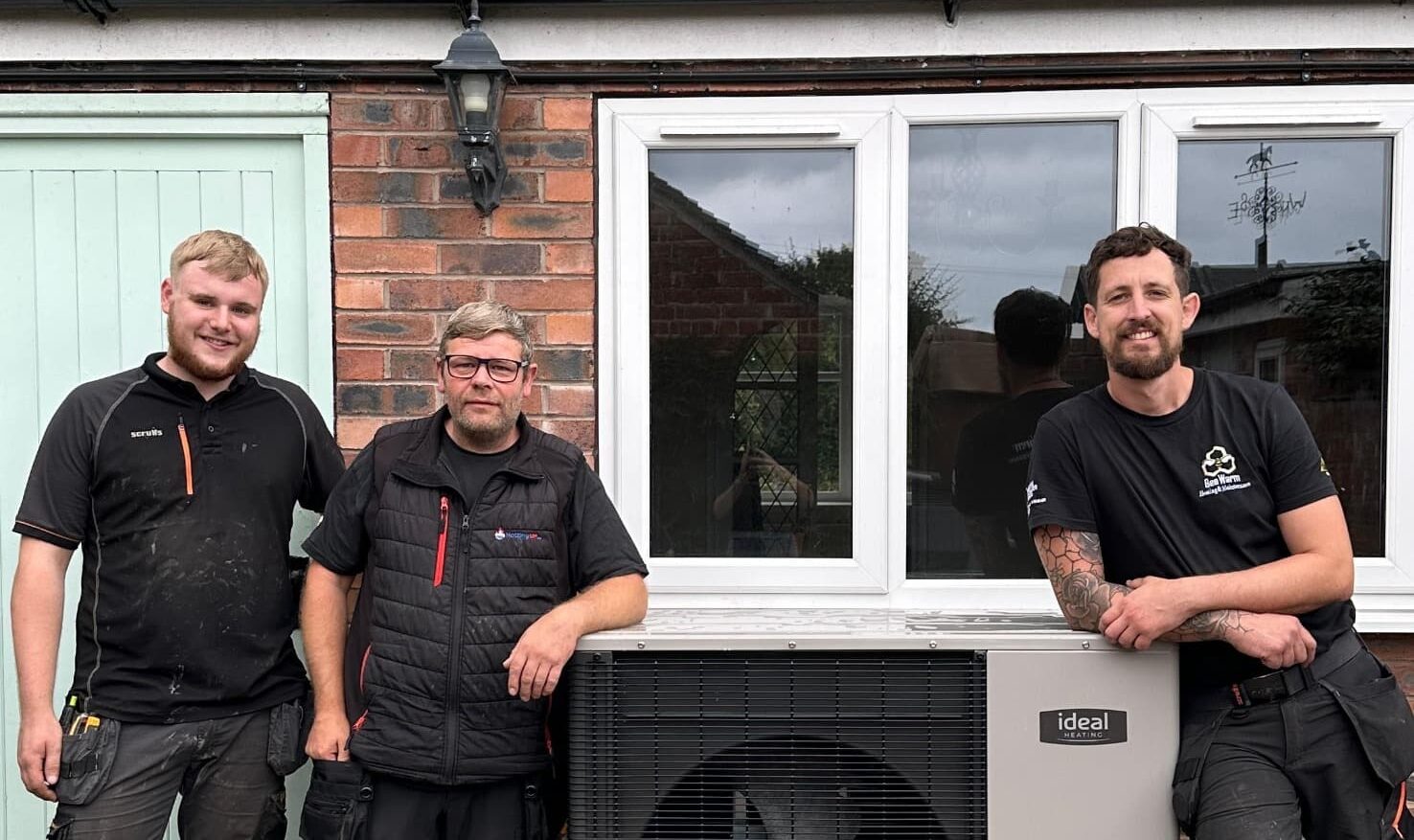 Bee Warm installers with an Ideal Logic Air heat pump installation