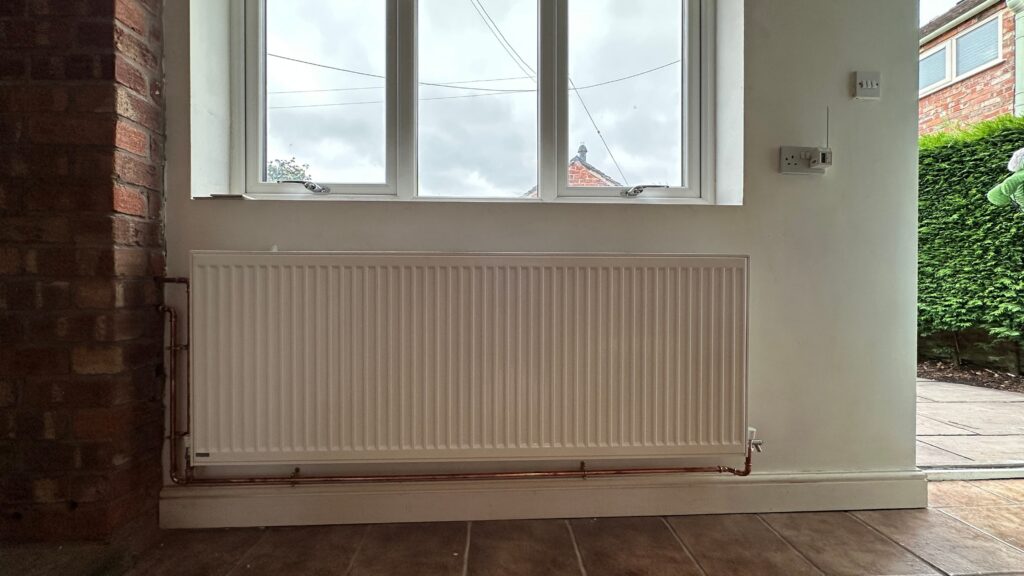 Stelrad Green Compact radiator installed with a heat pump heating system